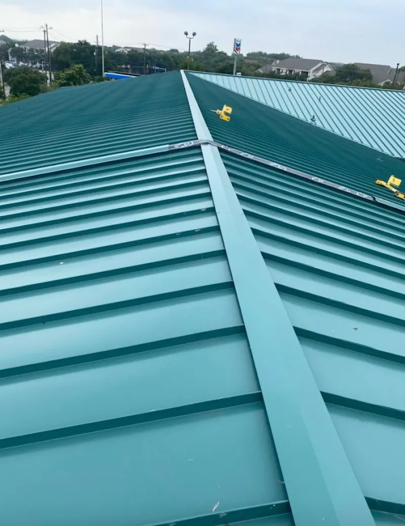 Green commercial metal roof ridge and valley for Metal Roof Repair in Cape St. Claire